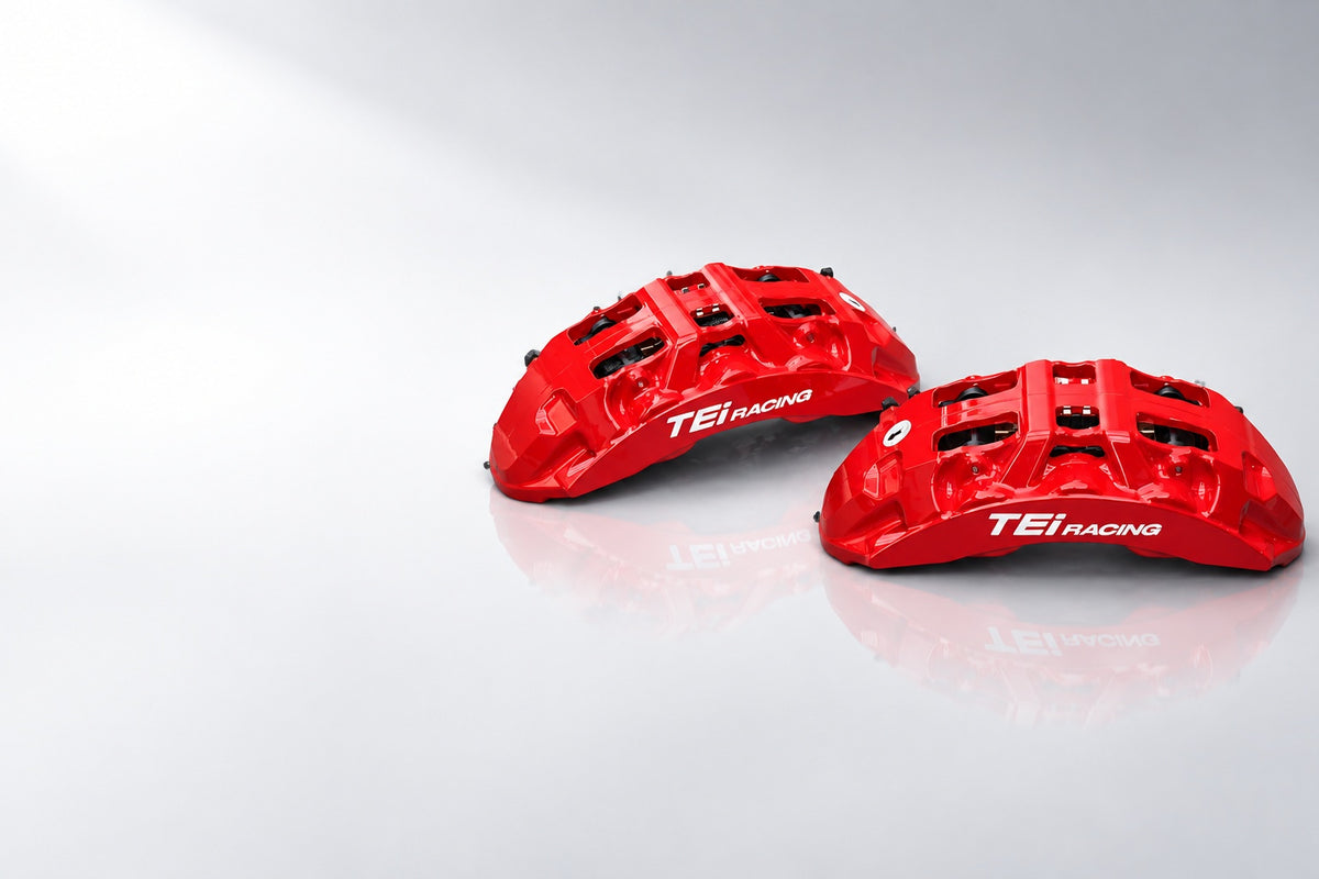 TEI Racing P60NS+ six-piston forged brake calipers in glossy red, staged in bright studio